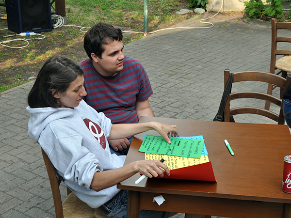 Adela and Mihai with coloured paper